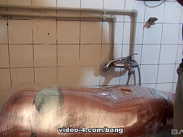 Angel Wicky is fully wrapped in plastic wrap which is filled with water - BANG!