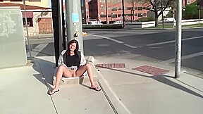 Attractive vixen shows shaved cunt in public