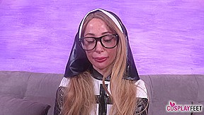 Blonde bombshell Ania as a sexy nun in black stockings