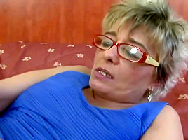 Blonde granny is wearing glasses while having anal sex with a handsome, black guy she likes