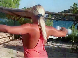 Blonde milf working out naked on the beach
