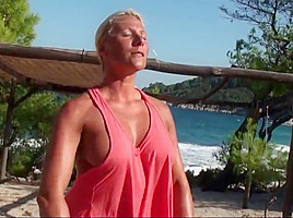 Blonde milf working out naked on the beach