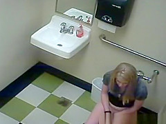 Blonde peeing in public toilet