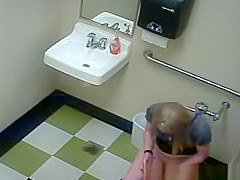 Blonde peeing in public toilet