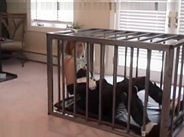 Bondage girl in cage