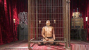 Brunette lesbian masturbates in cage