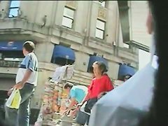 Candid street upskirt with sexy brunette in short skirt