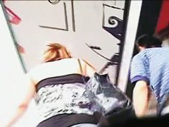 Chubby bitch in an extremely short skirt receives a upskirt taping