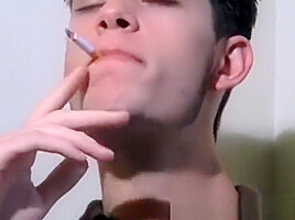 Cute twink smoker squirts cum before finishing cigarette
