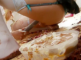 Eva and Mai make out in a messy floor in a close up shoot