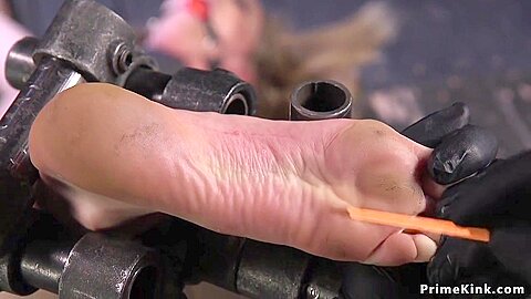 Gagged In Metal Device Babe Feet Tormented