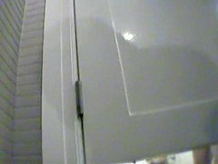 Girl changing in changing room reflecting in the mirror