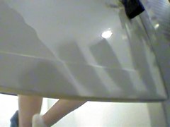 Girl changing in changing room reflecting in the mirror