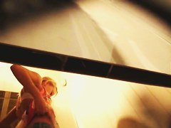 Girl in jeans and bra gets spied from below by