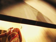 Girl in jeans and bra gets spied from below by