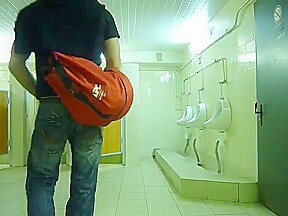 Guy stroke in public toilet