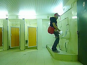 Guy stroke in public toilet