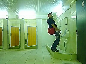 Guy stroke in public toilet