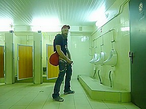 Guy stroke in public toilet