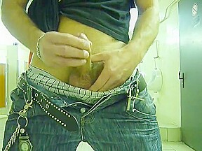 Guy stroke in public toilet
