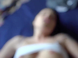 Horny brunette is moaning while getting fucked and enjoying while giving a footjob to her guy