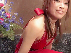 Hot babe in a gown enjoys a drink by herself