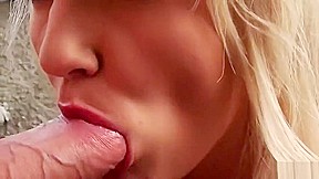 Lovely golden-haired harlot is blowing a cock out of the house