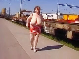 Mature Woman Shows Off Her Tits Outside