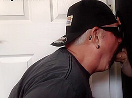 Mature gay closeup sucks and jerks cock through gloryhole