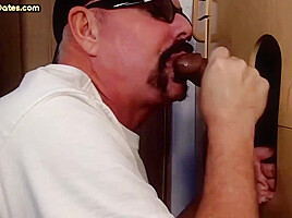 Mature gloryhole amateur DILF sucks and wanks black cock