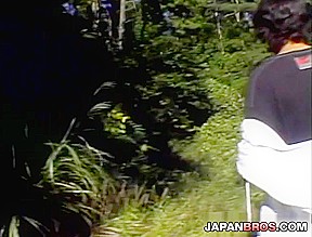 Nice Japanese nymphet has hands tied outdoor