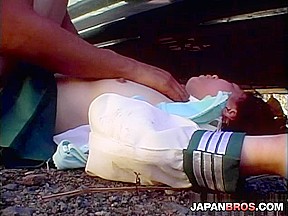 Nice Japanese nymphet has hands tied outdoor