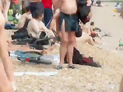 Pretty nudist girl steps out of the water