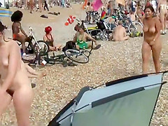 Pretty nudist girl steps out of the water