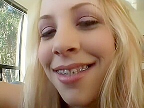 Provocative blonde with braces fulfills her urges with a big black rod