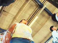 Rear and frontal upskirt shots of a curvy lady