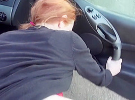 Redhead slut fucks dude with car