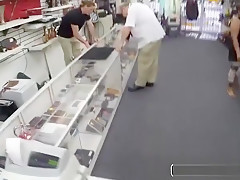 Sexy gay blows a cock in public pawn shop