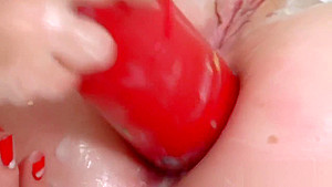 Sexy lesbians fill up their oversized asses with milk and ejaculate it out