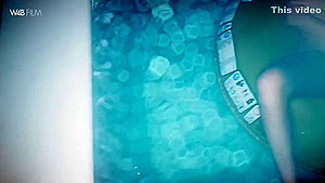 She rubs her pussy in the swimming pool