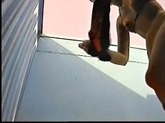 Slender girl stays in change room in erotic bikini