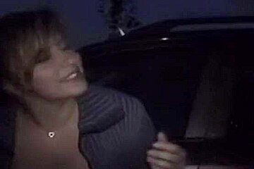 Some broad swinger blowing strangers in parking lot