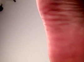 Teased by Asian girl showing off her big feet