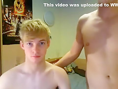 Two boys blow each other